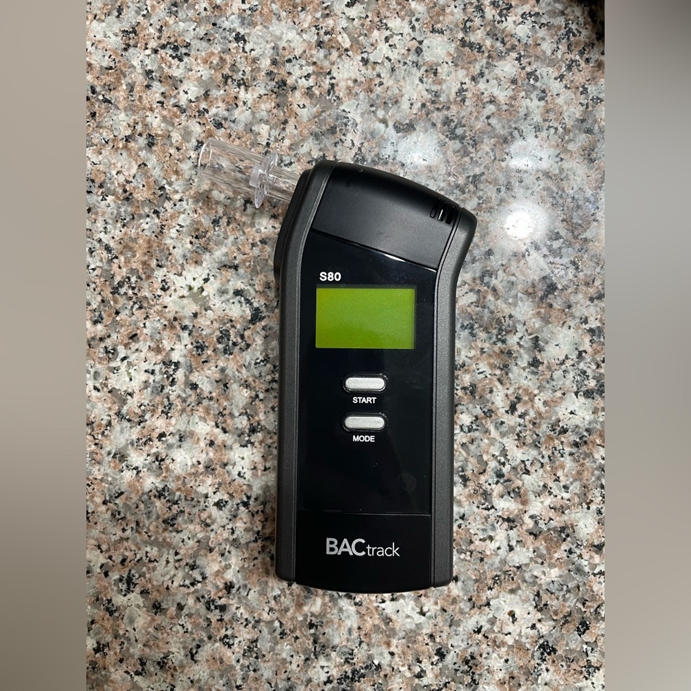 Unused BACtrack Breathalyzer with extra unopened mouthpieces
